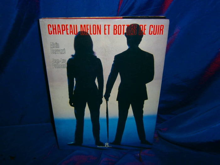 Chapeau melon et bottes de cuir