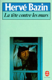 La tête contre les murs
