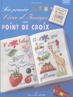 Son premier livre d'images au point de croix