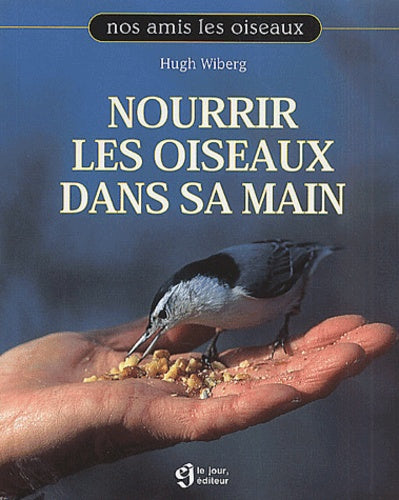 Nourrir les oiseaux dans sa main