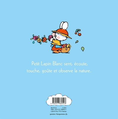 Petit lapin blanc découvre la nature